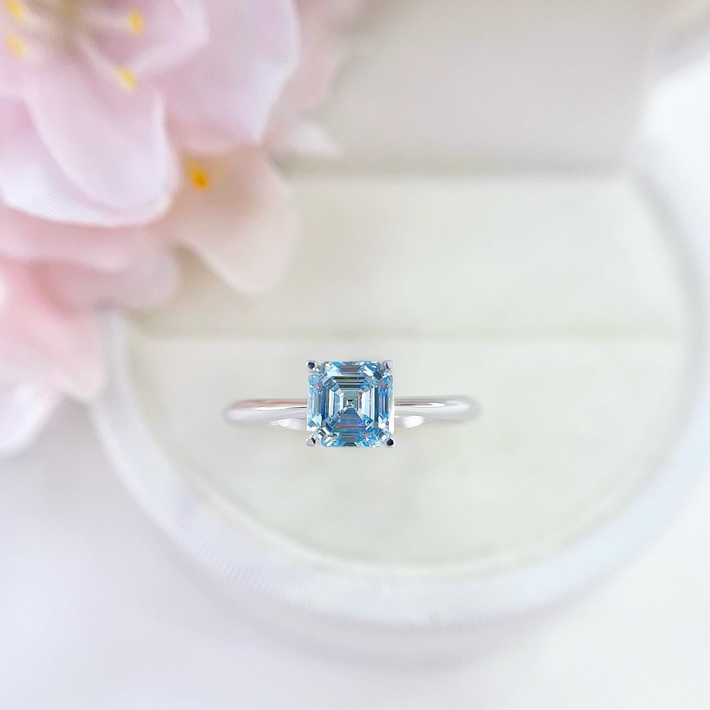 Asscher cut lab grown blue diamond engagement ring