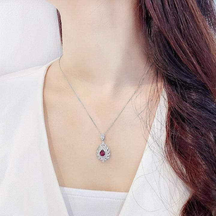 Halo setting pear cut lab grown ruby pendant necklace
